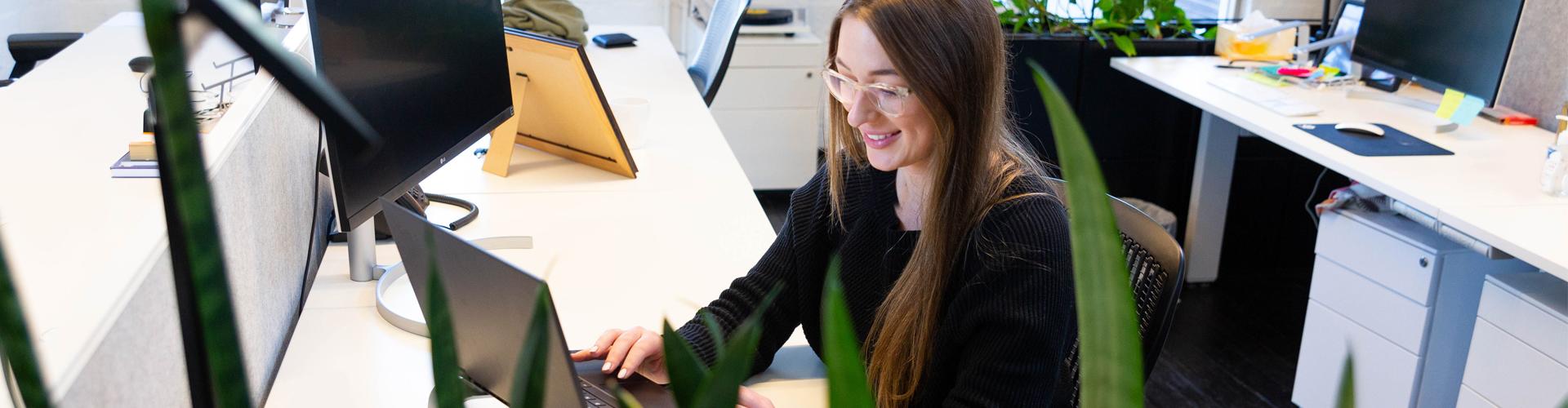 steph-at-desk-in-candlefox-office